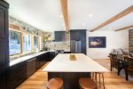 The oversized kitchen island provides additional seating for 5 guests.